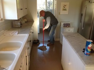 Donnie Wright - Cowboy since age 8 - mops up old cabin.